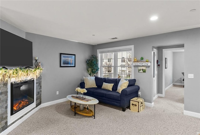 40 Saw Mill Dr Unit 203, North Kingstown, RI 02852 - living area featuring carpet floors, baseboards, a glass covered fireplace, and recessed lighting