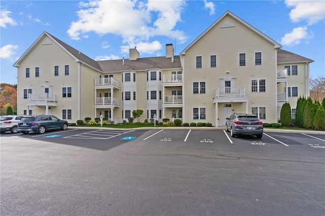40 Saw Mill Dr Unit 203, North Kingstown, RI 02852 - view of building exterior with uncovered parking