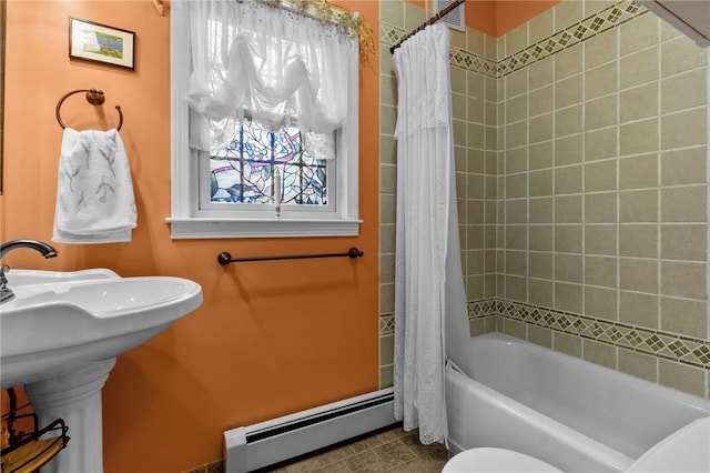 full bath with a baseboard heating unit, shower / tub combo with curtain, toilet, and tile patterned flooring