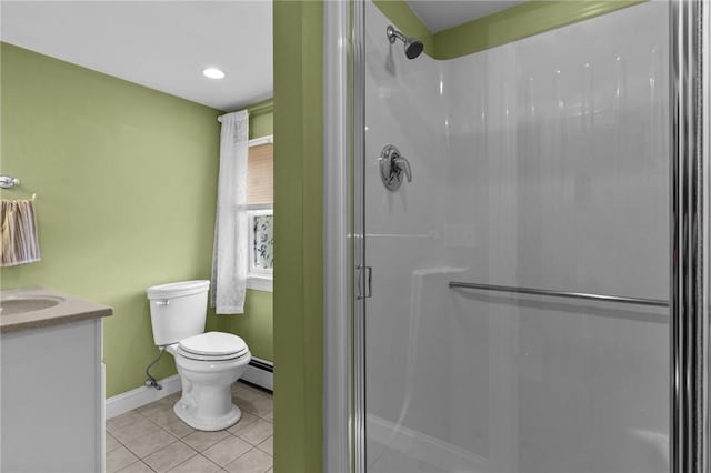 bathroom with a shower stall, toilet, tile patterned floors, a baseboard heating unit, and baseboards