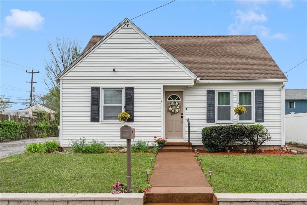 4 Freemont St, West Warwick, RI 02893 - view of front of house featuring roof with shingles