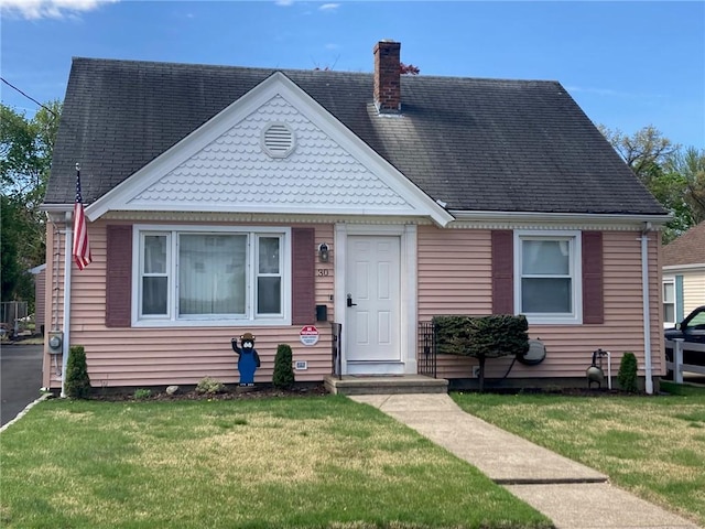 30 Charles St, Cranston, RI 02920 - view of front of property featuring a chimney and a front lawn