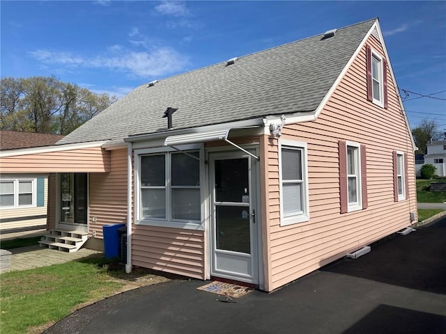 30 Charles St, Cranston, RI 02920 - rear view of house featuring entry steps and roof with shingles