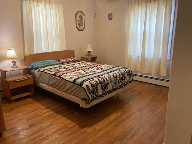 30 Charles St, Cranston, RI 02920 - bedroom with baseboard heating and wood finished floors