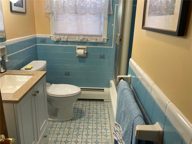 30 Charles St, Cranston, RI 02920 - full bathroom with a baseboard heating unit, toilet, a shower with shower door, a wainscoted wall, and tile patterned floors