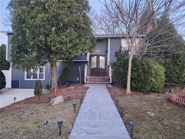 8 Marigold Ct, Cranston, RI 02920 - view of property hidden behind natural elements featuring french doors