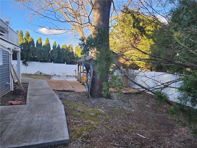 8 Marigold Ct, Cranston, RI 02920 - fenced backyard featuring a patio area