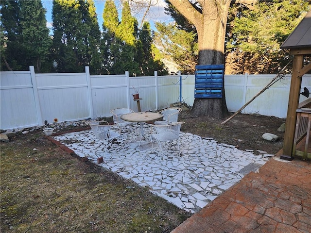 8 Marigold Ct, Cranston, RI 02920 - fenced backyard with a patio
