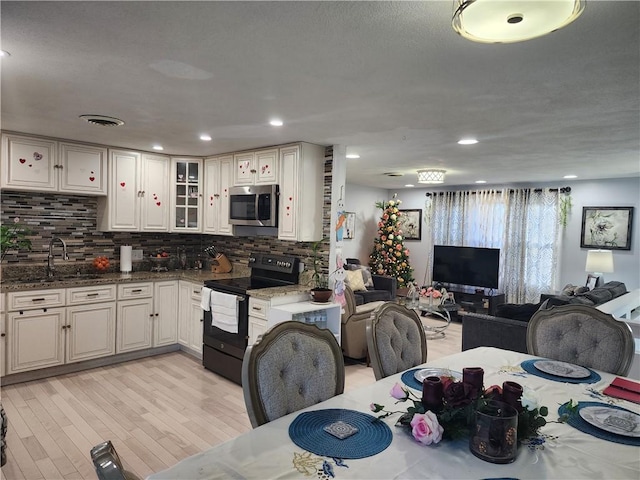 8 Marigold Ct, Cranston, RI 02920 - dining space featuring light wood-style flooring and recessed lighting