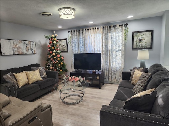 8 Marigold Ct, Cranston, RI 02920 - living area featuring light wood finished floors and recessed lighting