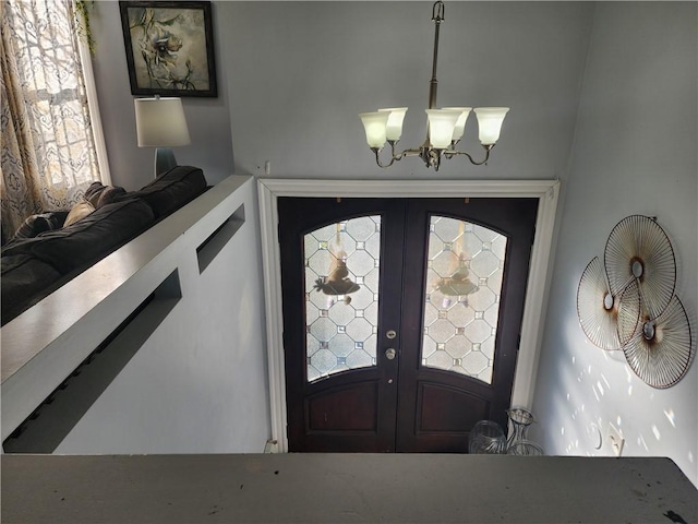 8 Marigold Ct, Cranston, RI 02920 - entryway featuring a chandelier and french doors