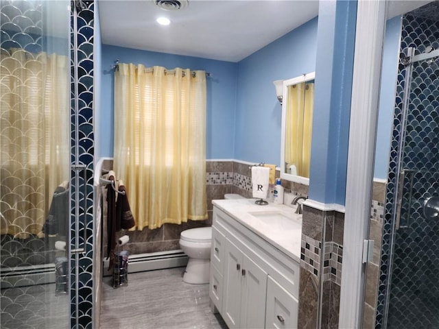 8 Marigold Ct, Cranston, RI 02920 - bathroom with tile walls, a baseboard radiator, a stall shower, toilet, and vanity