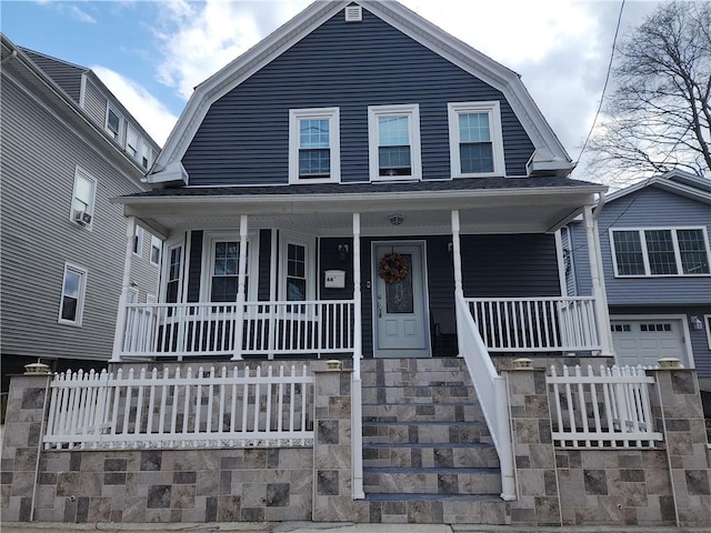64 Westwood Ave, Cranston, RI 02905 - view of front of house with a gambrel roof, a porch, and fence