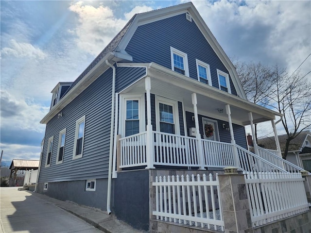 64 Westwood Ave, Cranston, RI 02905 - view of front of house with a porch and a gambrel roof