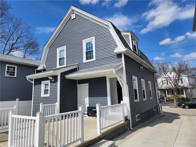 64 Westwood Ave, Cranston, RI 02905 - back of house featuring a porch, a gambrel roof, and roof with shingles