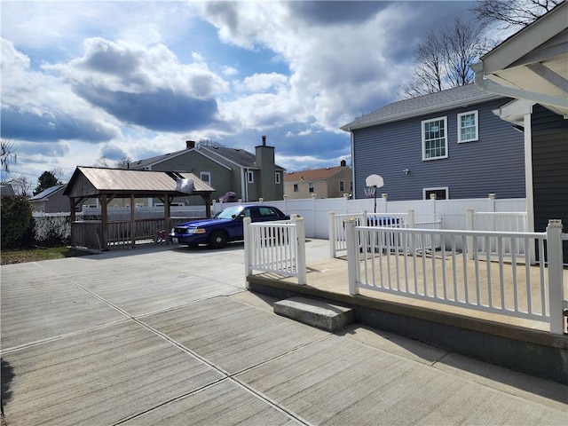 64 Westwood Ave, Cranston, RI 02905 - wooden terrace with a gazebo, fence, a residential view, concrete driveway, and a patio area