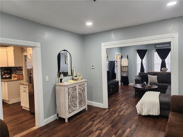 64 Westwood Ave, Cranston, RI 02905 - living area with dark wood finished floors, recessed lighting, and baseboards