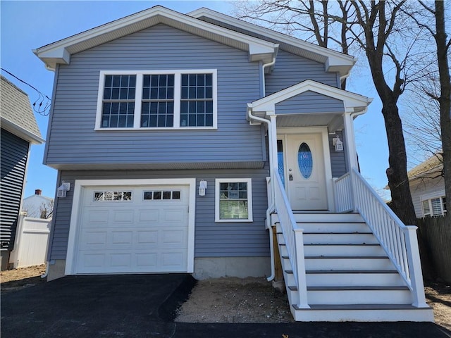 68 Westwood Ave, Cranston, RI 02905 - split level home with an attached garage and driveway