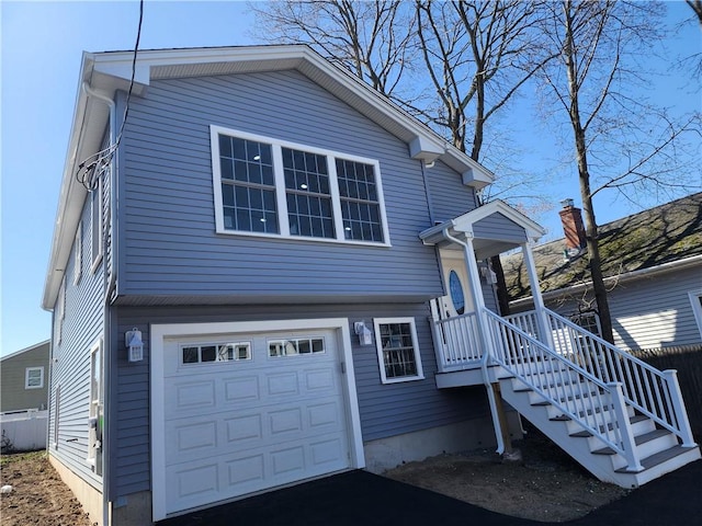 68 Westwood Ave, Cranston, RI 02905 - tri-level home featuring a garage