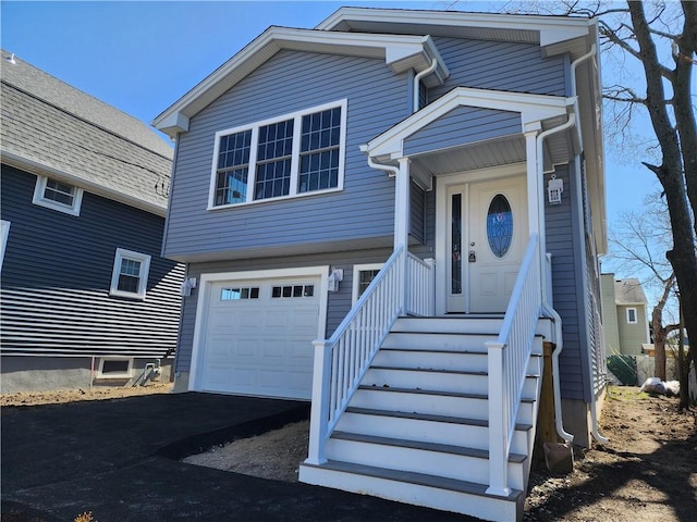 68 Westwood Ave, Cranston, RI 02905 - view of front of property featuring a garage and driveway