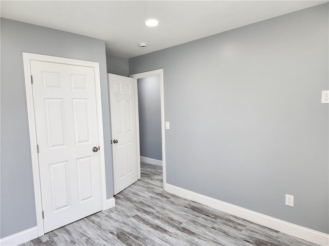 68 Westwood Ave, Cranston, RI 02905 - unfurnished bedroom featuring baseboards, wood finished floors, and recessed lighting