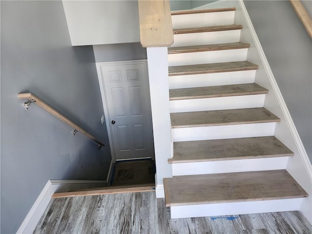 68 Westwood Ave, Cranston, RI 02905 - stairway featuring wood finished floors and baseboards