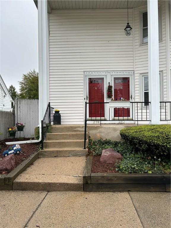 view of exterior entry featuring a porch