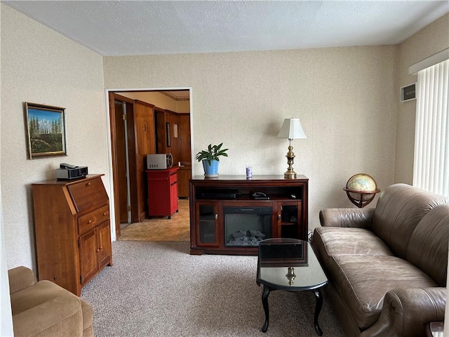 living room featuring light carpet and a textured wall