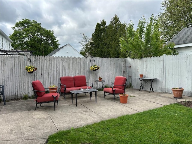 view of patio with outdoor lounge area and a fenced backyard