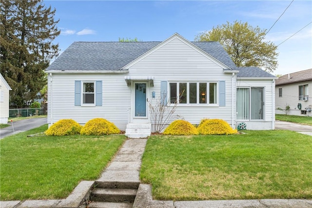 11 Homestead St, Smithfield, RI 02917 - view of front of house with a shingled roof and a front lawn