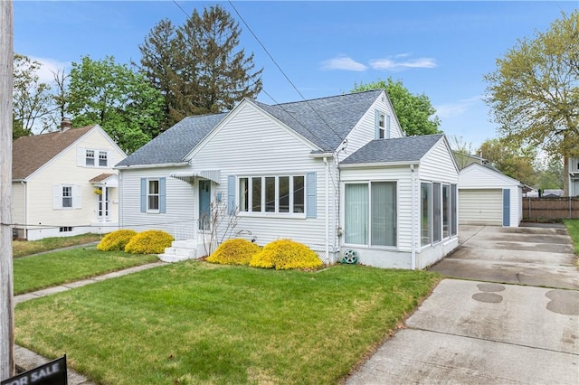11 Homestead St, Smithfield, RI 02917 - bungalow featuring a garage, an outdoor structure, roof with shingles, and a front yard
