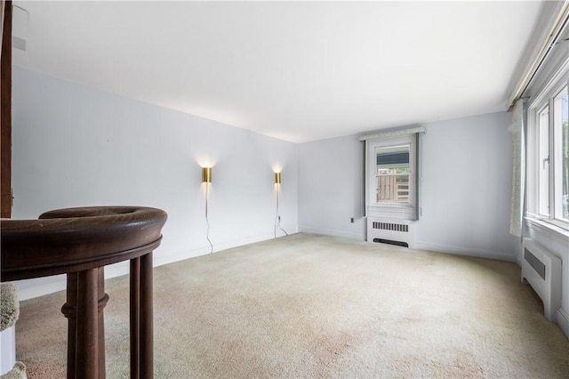 11 Homestead St, Smithfield, RI 02917 - carpeted empty room featuring radiator heating unit, healthy amount of natural light, and baseboards