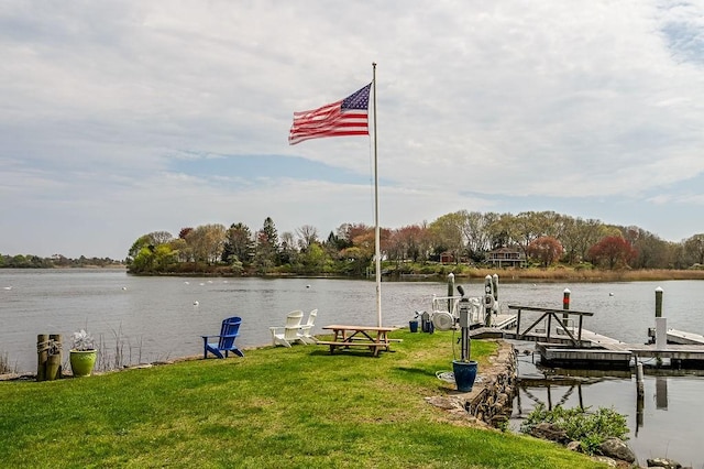 dock with a water view and a lawn