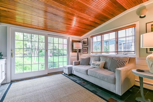 living area featuring lofted ceiling, wood ceiling, and a baseboard heating unit