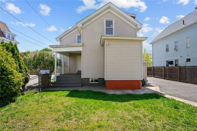 rear view of property with covered porch