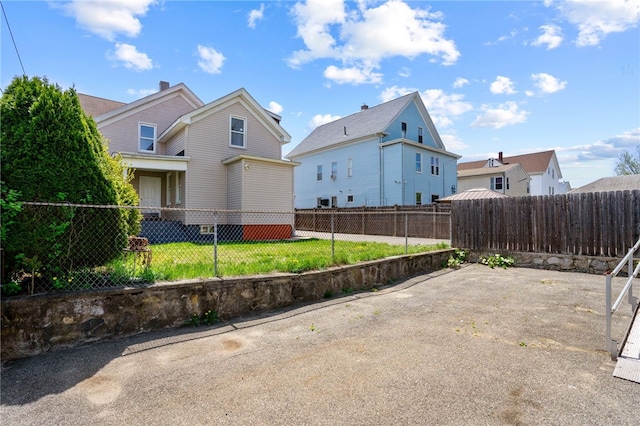 view of side of property with a patio
