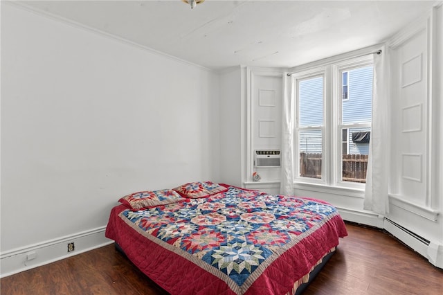 bedroom with wood finished floors and crown molding