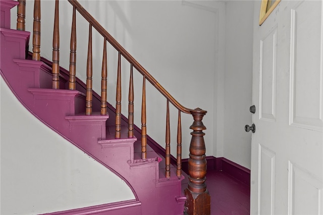 stairway featuring baseboards
