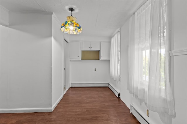 hall featuring dark wood-style floors and a baseboard heating unit