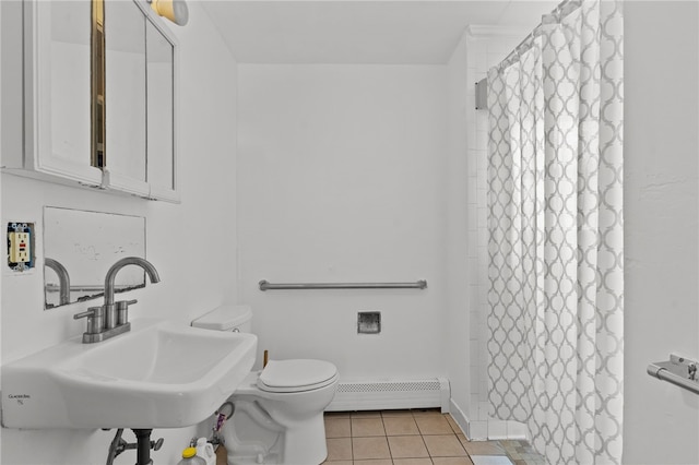 full bathroom with baseboard heating, a sink, tile patterned flooring, toilet, and a shower with shower curtain