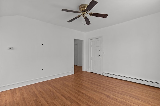 unfurnished room featuring a baseboard heating unit, light wood-style flooring, a ceiling fan, and baseboards