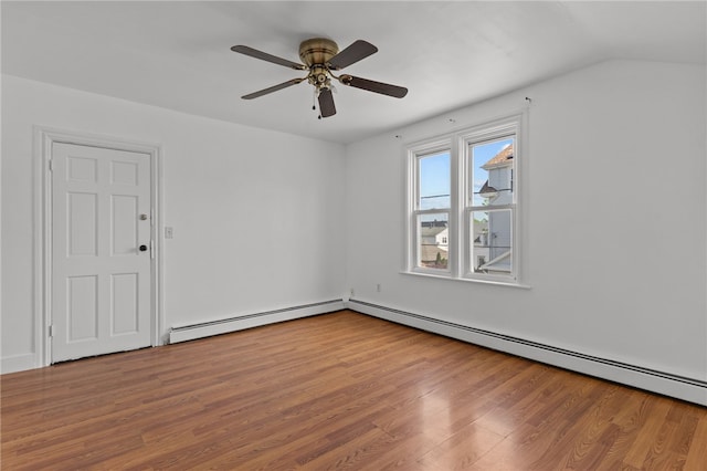 unfurnished room with wood finished floors, baseboard heating, and ceiling fan