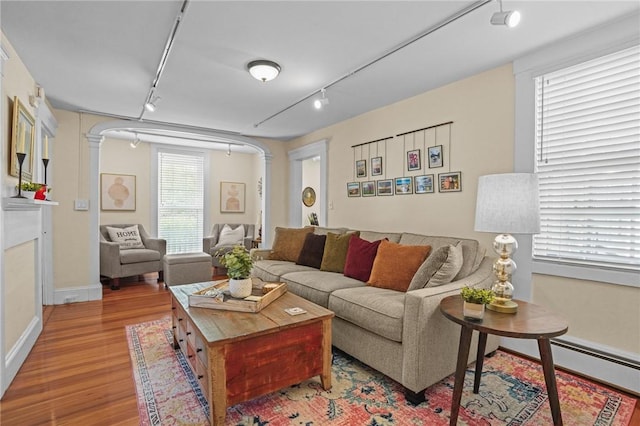 275 Hope St, Bristol, RI 02809 - living area with track lighting, wood finished floors, and baseboards