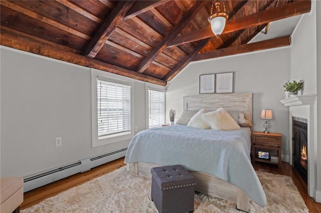 275 Hope St, Bristol, RI 02809 - bedroom featuring wooden ceiling, wood finished floors, baseboard heating, and a warm lit fireplace