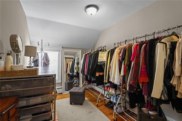 275 Hope St, Bristol, RI 02809 - walk in closet with wood finished floors, lofted ceiling, and baseboard heating