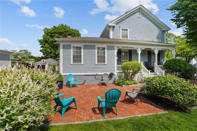 275 Hope St, Bristol, RI 02809 - back of property with covered porch and stairway