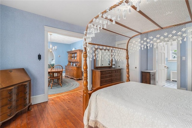 35 Miles Ave, East Providence, RI 02914 - bedroom featuring wood-type flooring, a chandelier, and baseboards