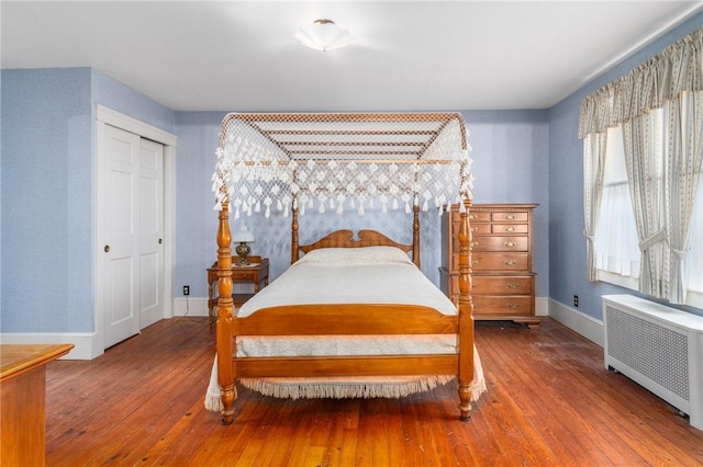 35 Miles Ave, East Providence, RI 02914 - bedroom featuring radiator heating unit, hardwood / wood-style floors, baseboards, and a closet