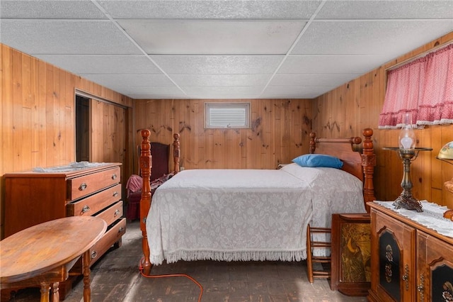 35 Miles Ave, East Providence, RI 02914 - bedroom featuring wood walls, wood-type flooring, and a drop ceiling