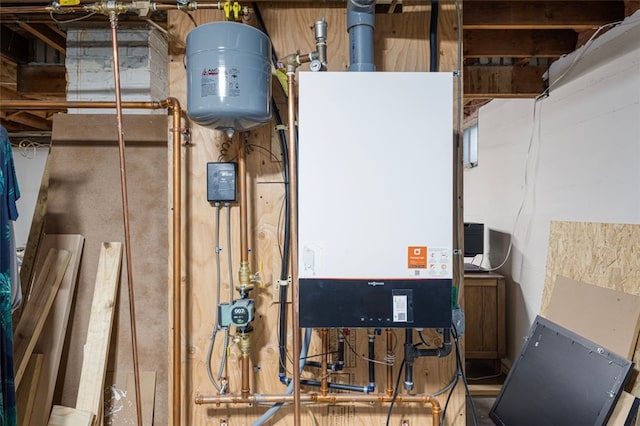utility room featuring water heater